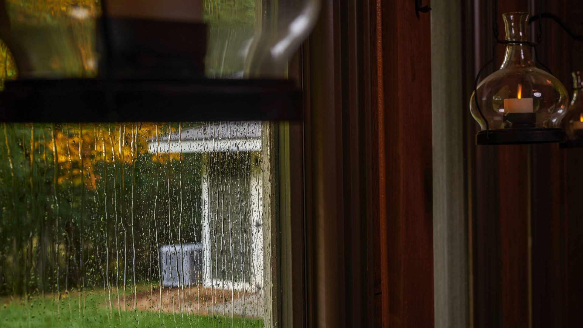 a glass door with a bottle of liquid in it