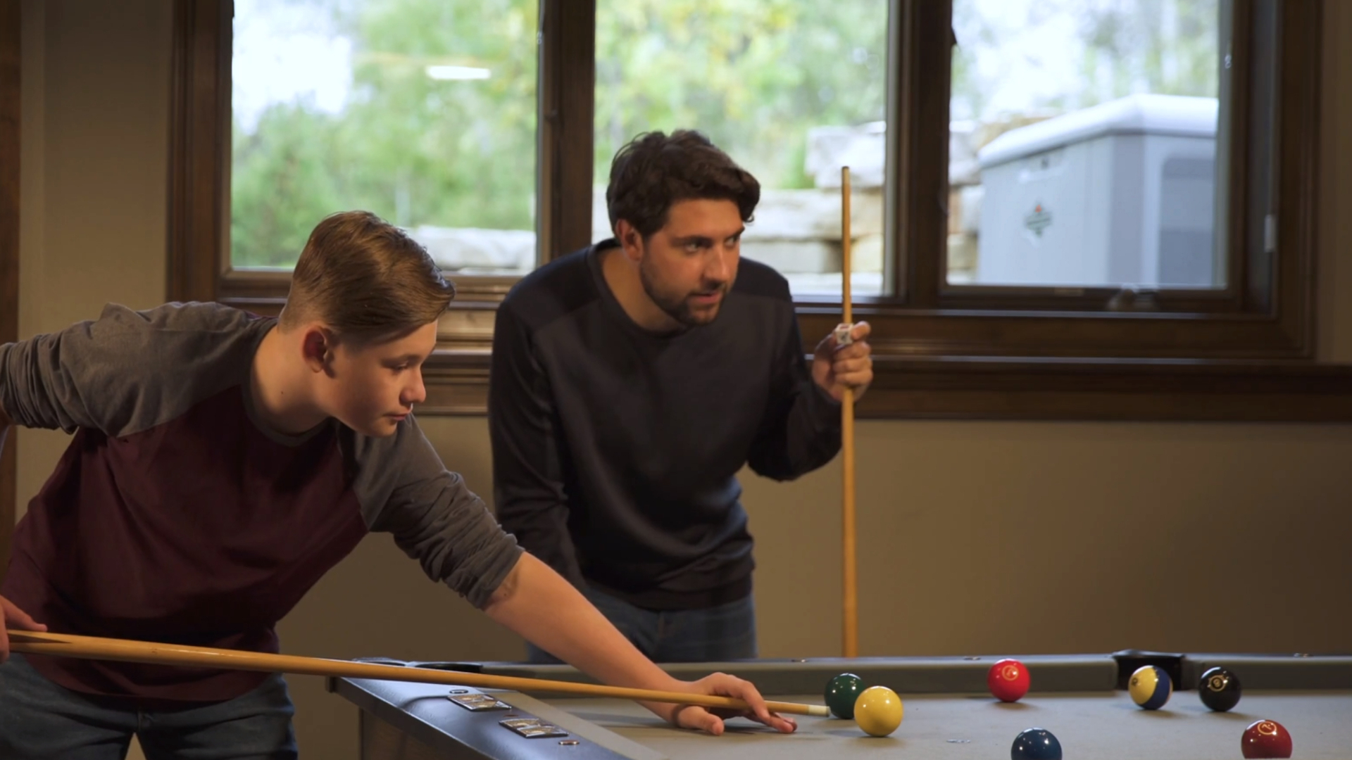 Vladimir Karaleev et al. playing pool