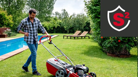 a person pushing a lawn mower