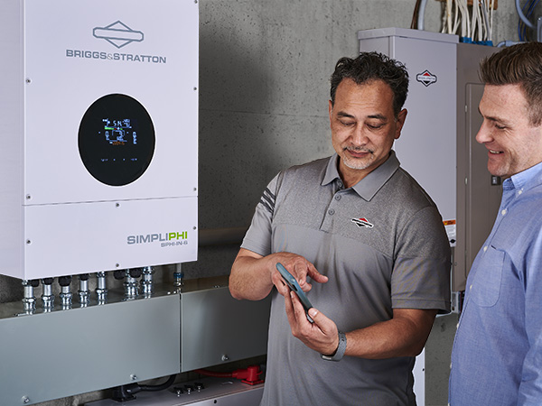 Energy storage system installer explaining EnergyTrak