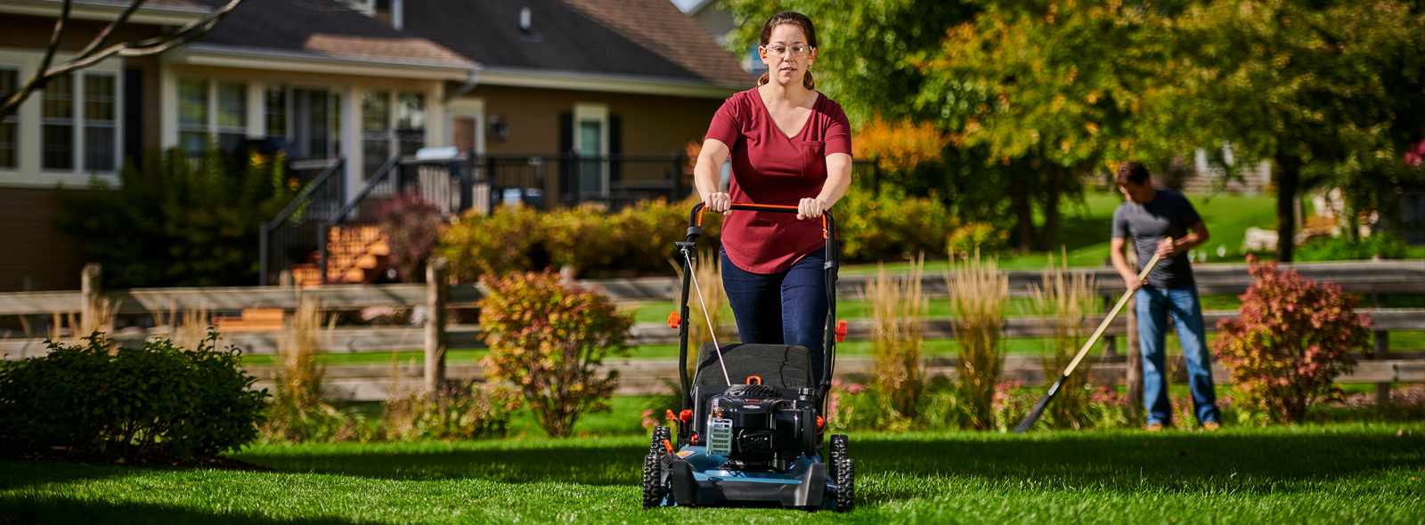 Woman pushing a Briggs & Stratton lawn mower