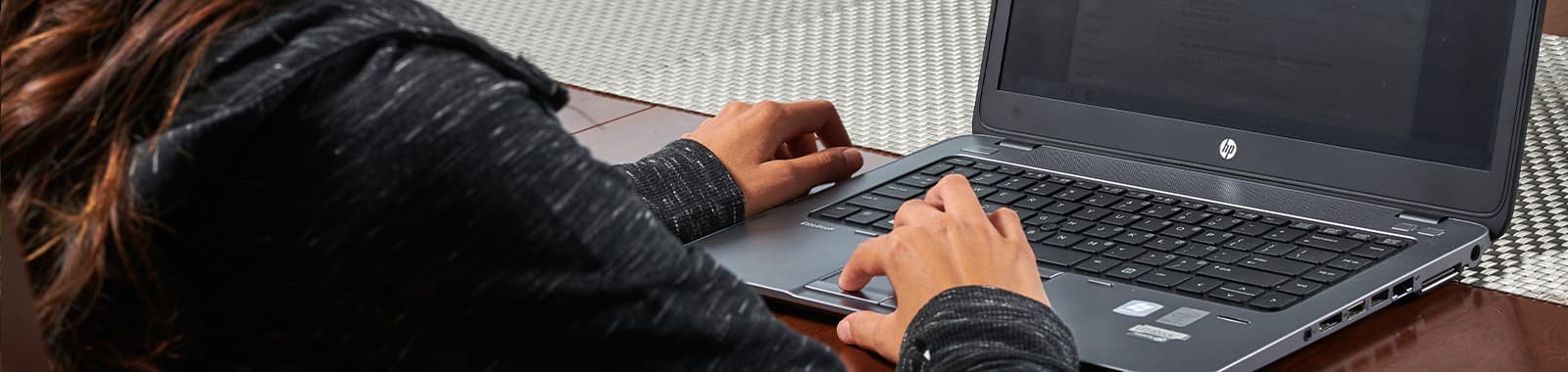 Woman using laptop on table