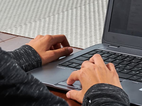 Woman using laptop on table