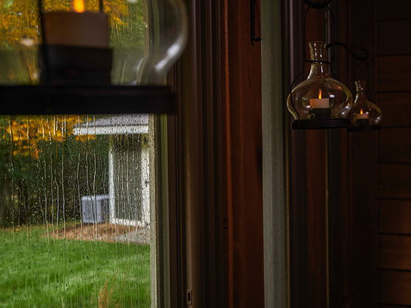 Home standby generator outside home during storm