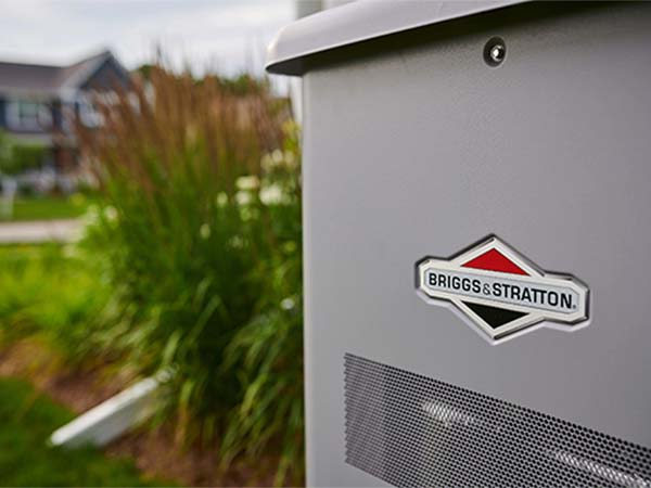 Briggs & Stratton standby generator next to a home in a neighborhood. 