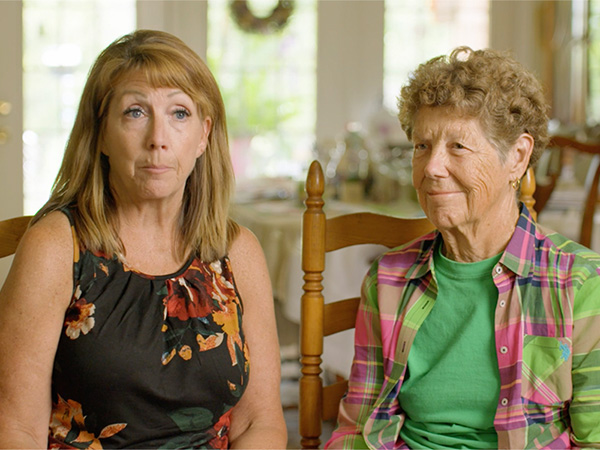 Headshot of Lee Townsend with her mother sitting in her house.