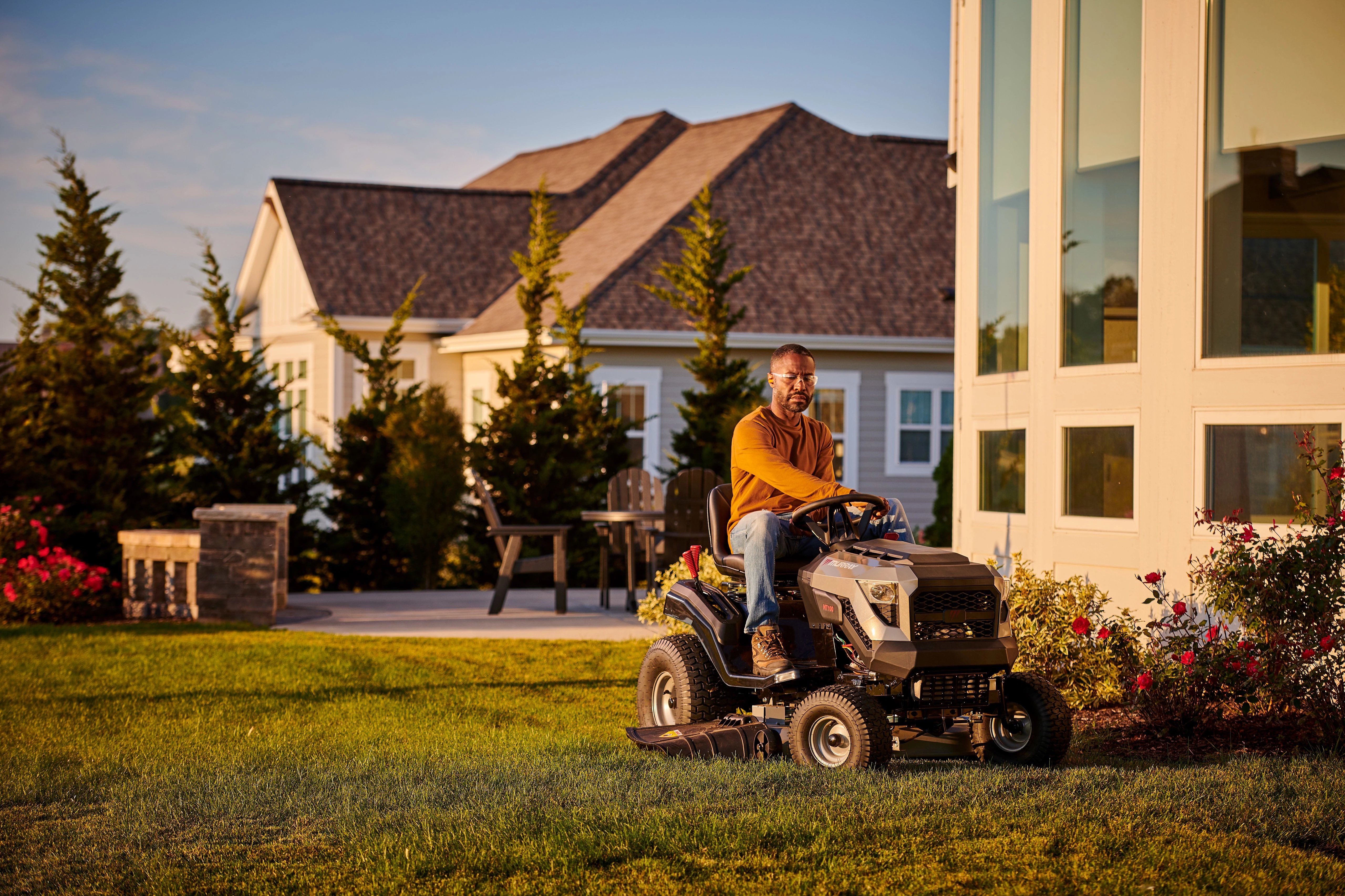 Man on a Murray lawn mower powered by Briggs & Stratton PXi V-Twin Engine.
